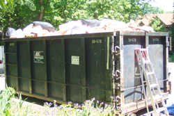 Dumpster Filled with Contaminated Insulation